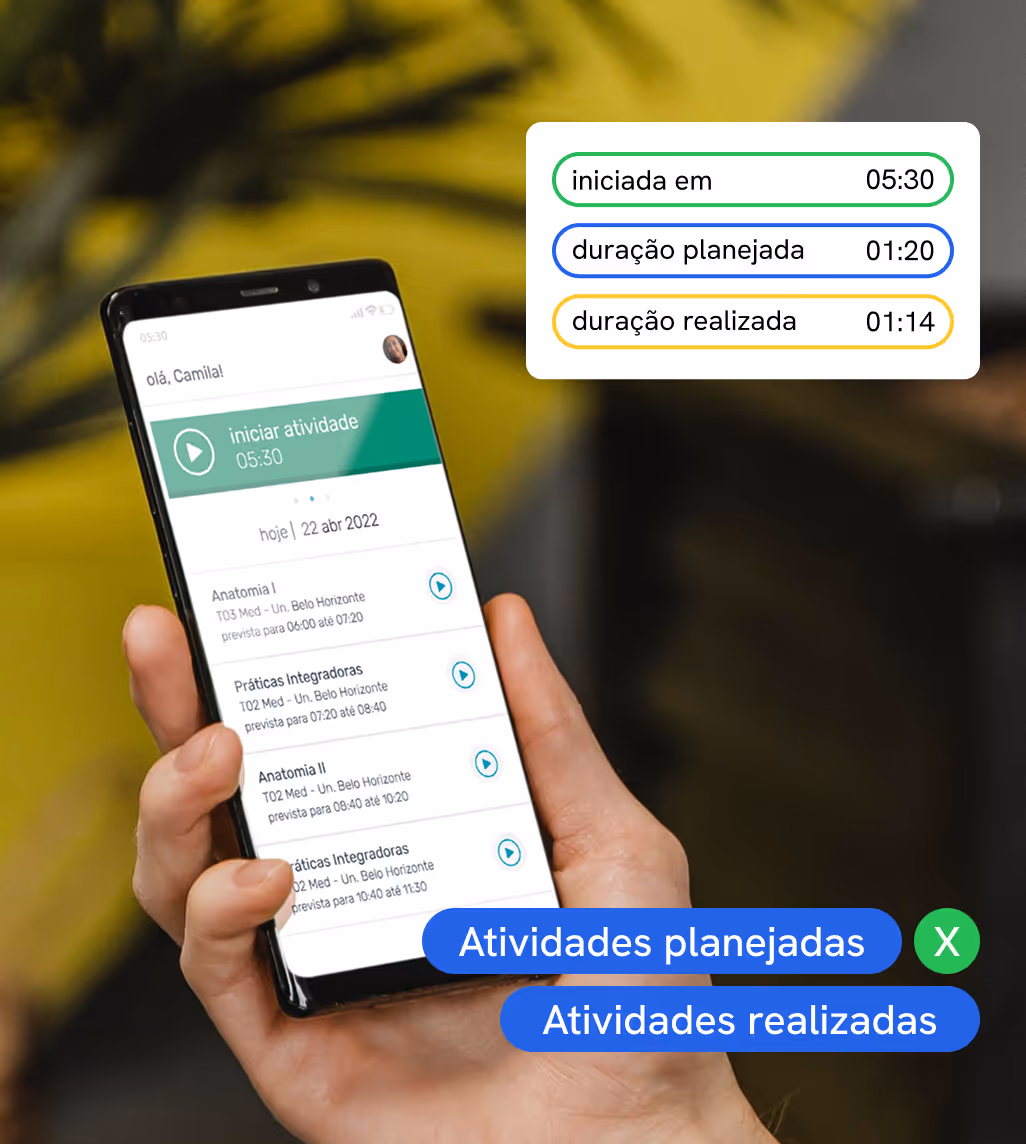 Hand holding a phone with a task management app open.